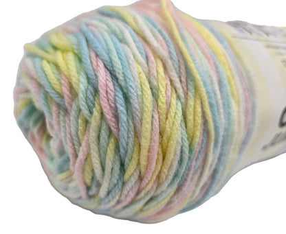 Close-up image of a single skein of Caron_Jumbo_Yarn_in the color_Baby_Rainbow with label on a white background.