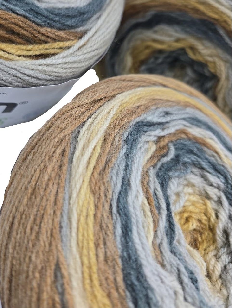 Close-up image of Caron Skinny Cakes yarn in the color Tiramisu.