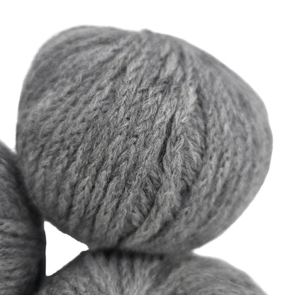 Close-up image of Catena_by_Berroco yarn in Color_5409_Tourmaline on a white background.