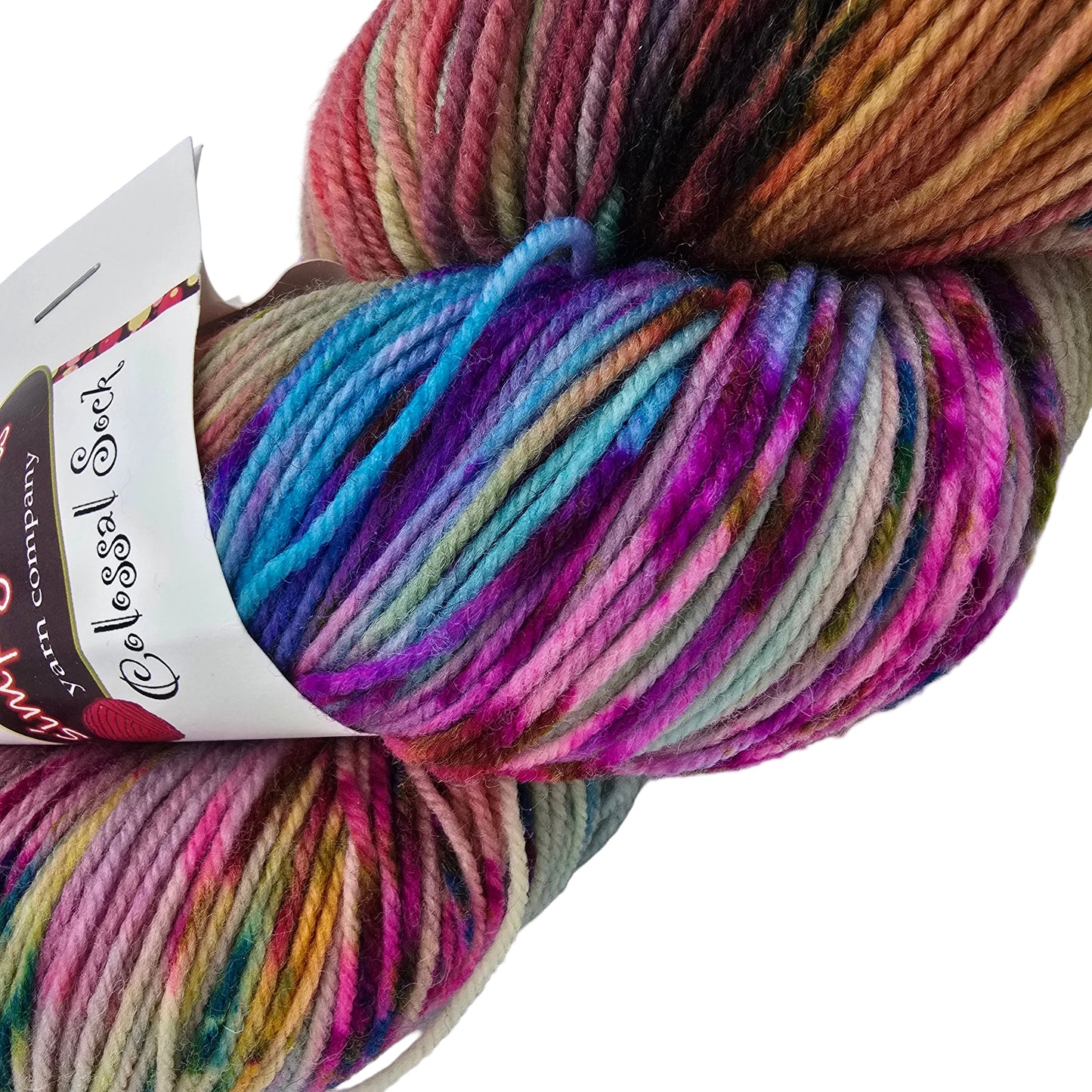 Close-up Image of a single Skein of Colossal Sock yarn by Dream in Color in the color Sagrada with label on a white 