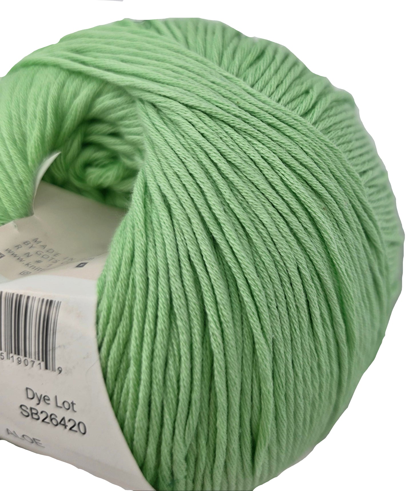 Close-up image of Eco Organic Cotton yarn by Ella Rae in the color Aloe with partial label on a white background.