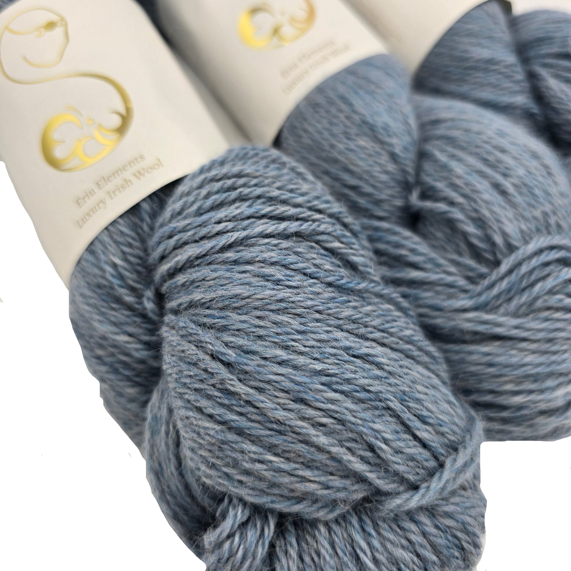 Close-up image of Eriu Elements DK yarn in the color Wisp with partial label on a white background.