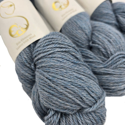 Close-up image of Eriu Elements DK yarn in the color Wisp with partial label on a white background.