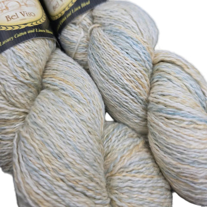Close-up image of two skeins of Euro Yarns Select Bel Viso yarn in the color Cordelia with partial labels in a white background.