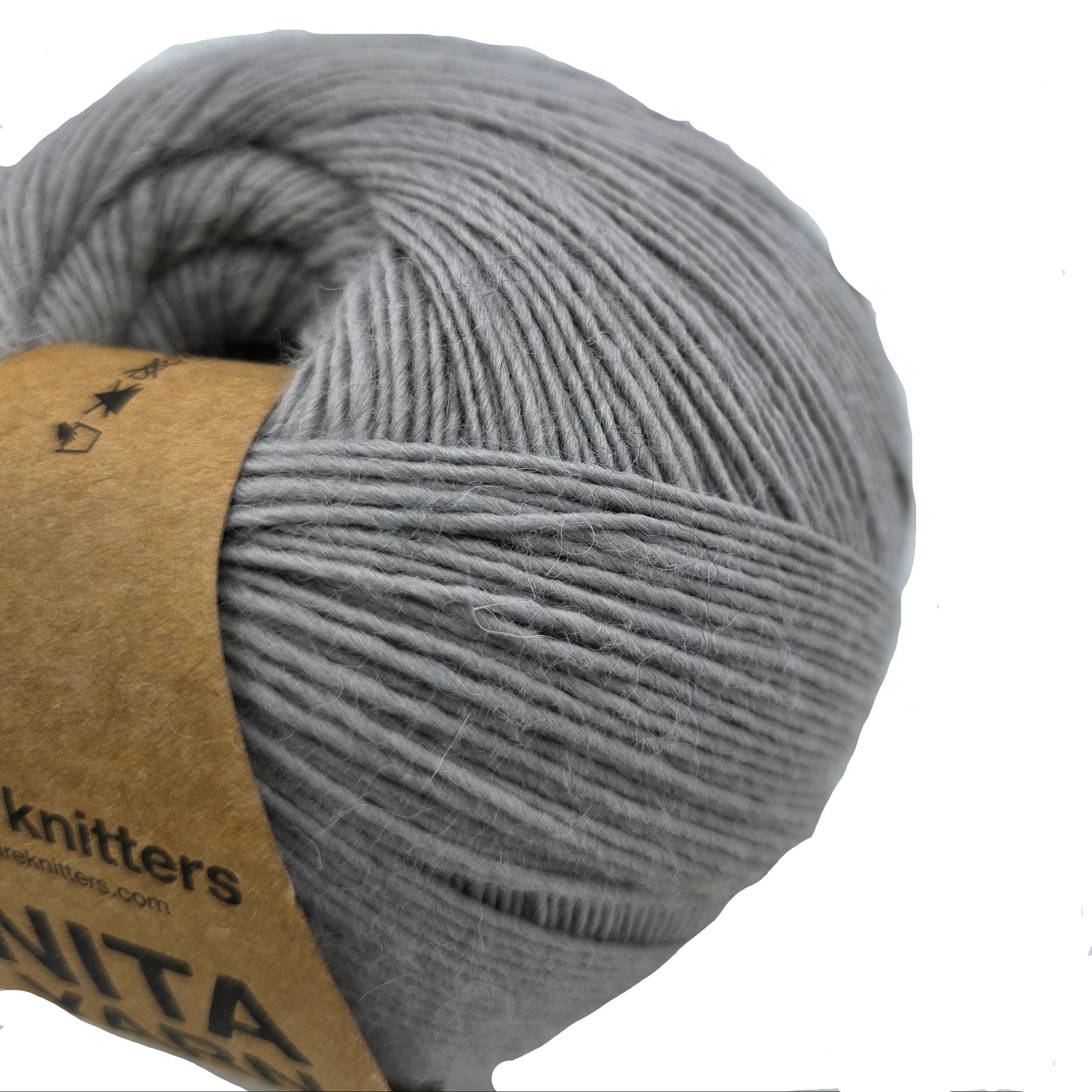 Close-up image of a single ball of Finita by We Are Knitters in Grey with partial label on a white background.
