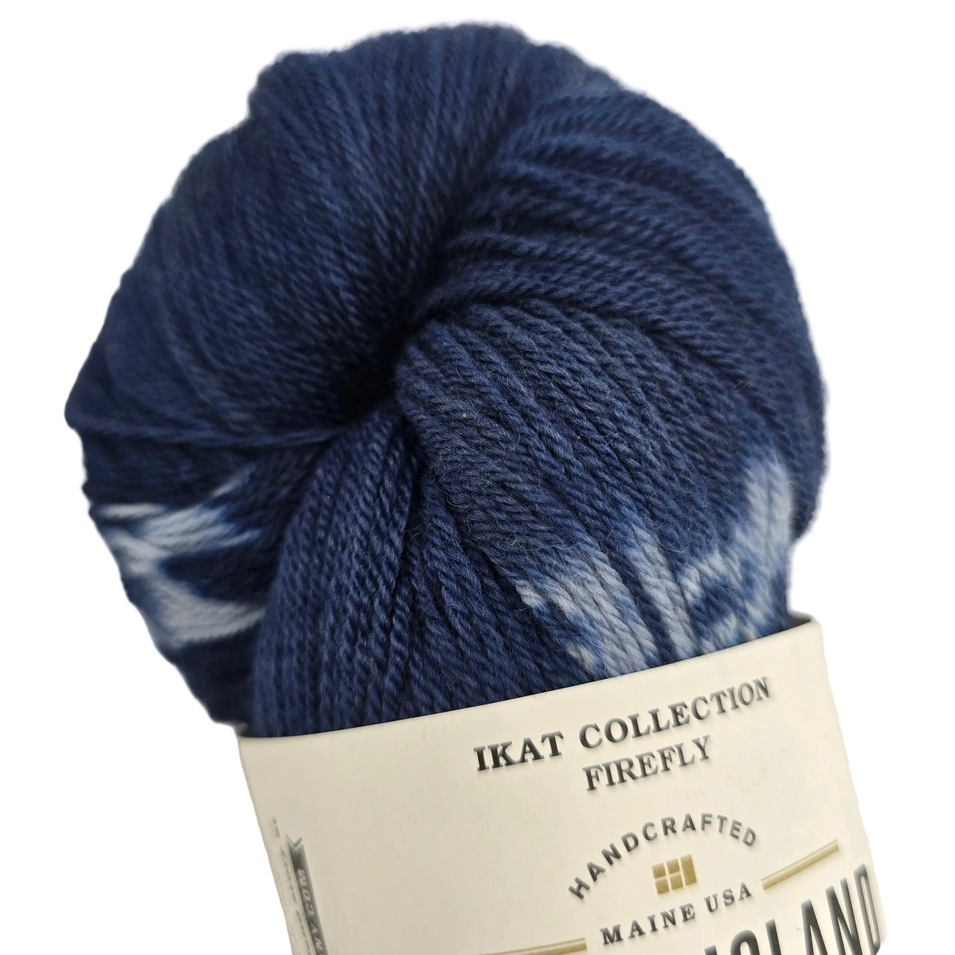 Ikat Collection Firefly Yarn by Swans Island  in the color Firefly Sapphire IFF201 with partial label on a white background.