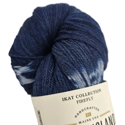 Ikat Collection Firefly Yarn by Swans Island  in the color Firefly Sapphire IFF201 with partial label on a white background.