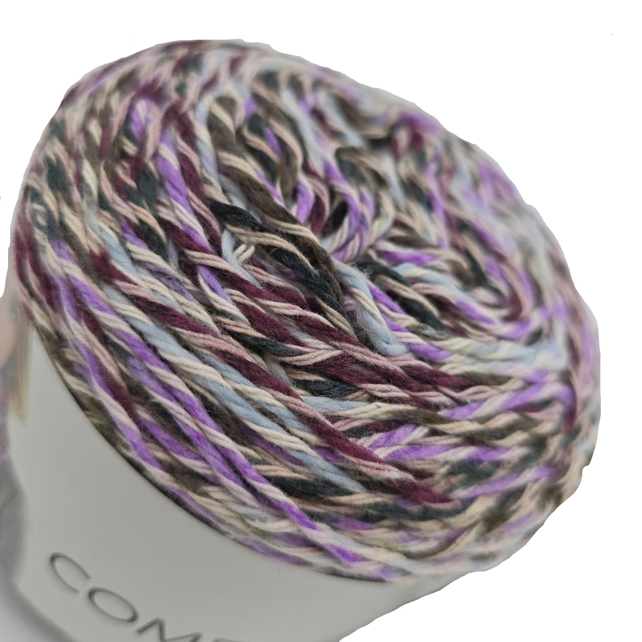 Close-up image of a single cake of Lion Brand Comfy Cotton Blend yarn in the color Blueberry Muffin with partial label on a white background.