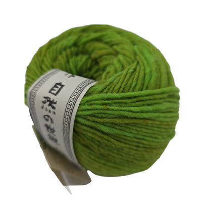 Close-up image of Green ball of Malvinas by Noro Brand yarn with a label on a white background