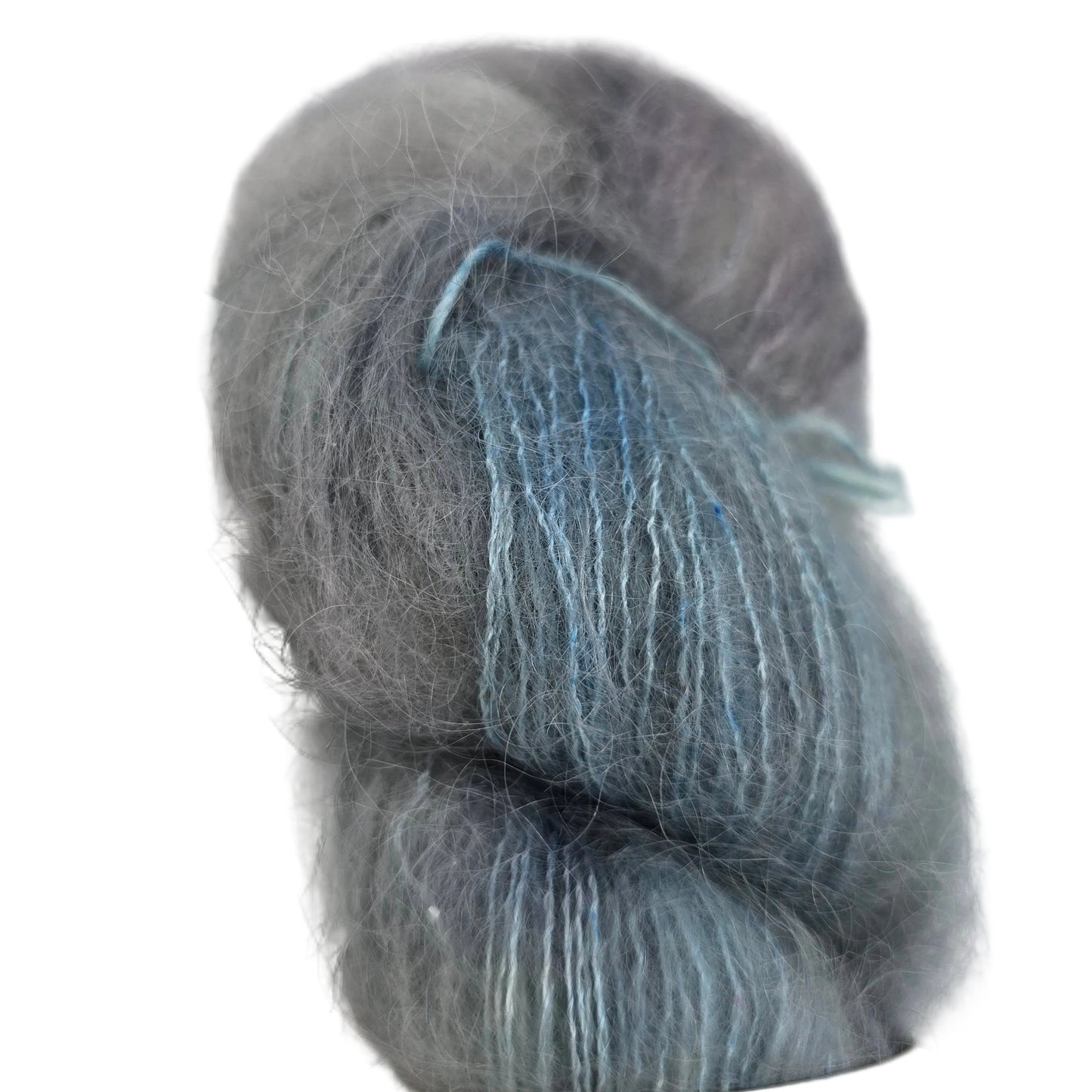 Close-up image of a single skein of Marvelous Mohair yarn by Emma's Yarn in the color Chasing Waterfalls on a white background.