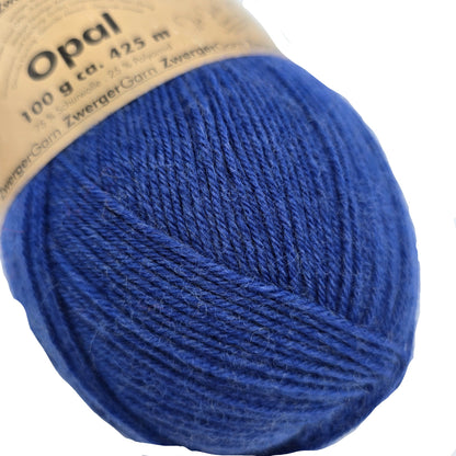 Close-up image of Opal Uni Solid 4-Ply Yarn by Opal in Color 1419 with partial label on a white background.