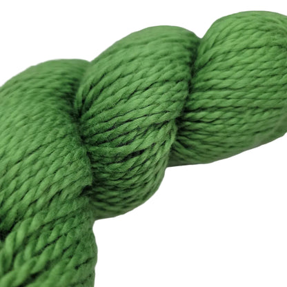 Close-up image of Organic Cotton Worsted by Blue Sky Fibers Yarn in the color Pickle 633 on a white background.