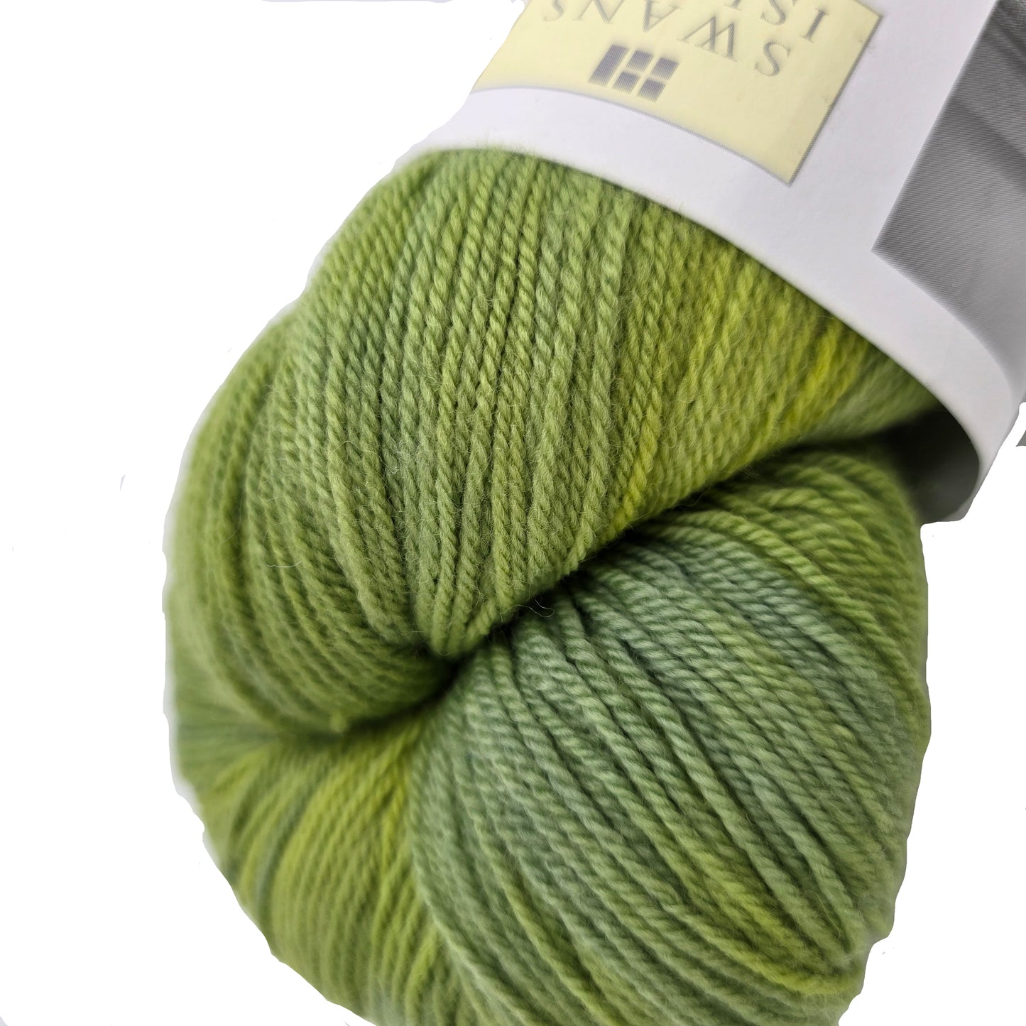 Close-up Image of Organic Merino_by_Swans_Island yarn in the color_Spring_Green_YF109 with partial label on a white background.