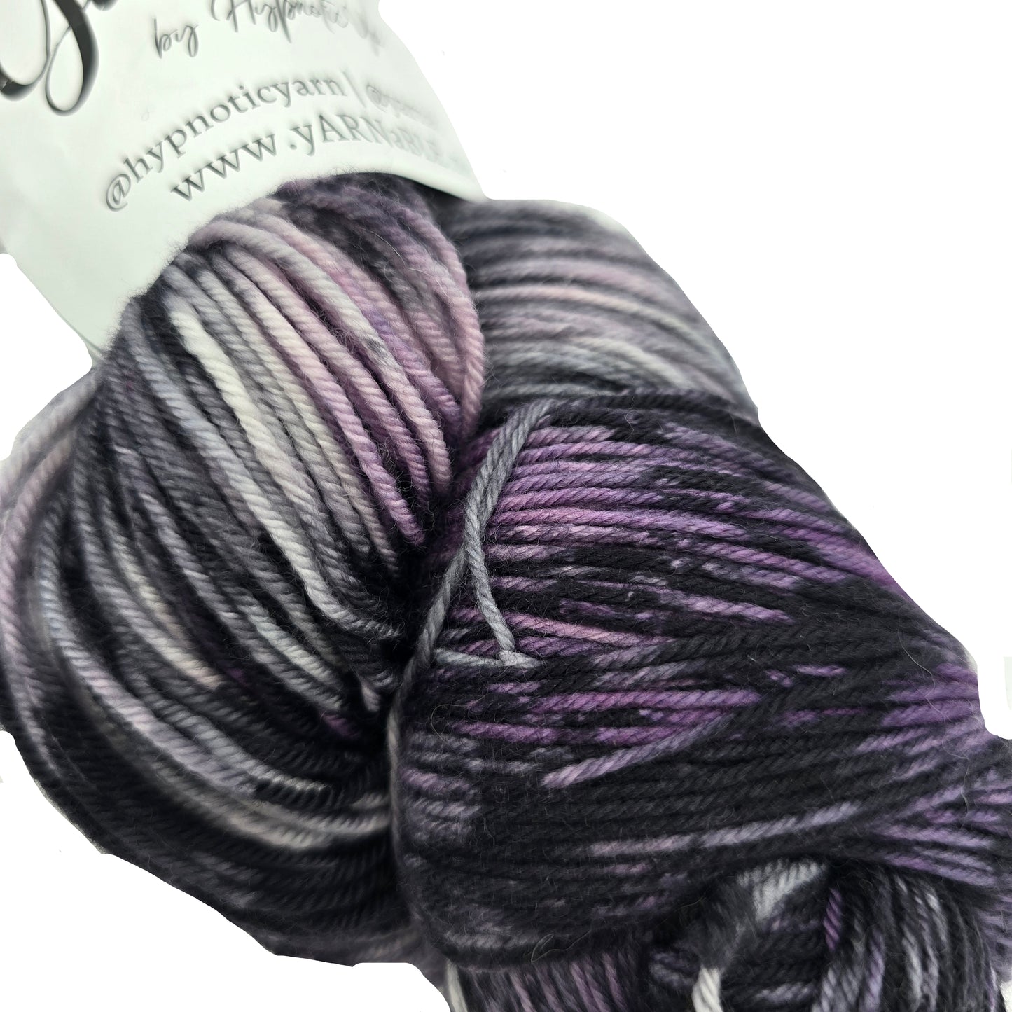Close-up image of Plush Sock yarn by Hypnotic Yarn in the color Storm Watch with partial label on a white background.