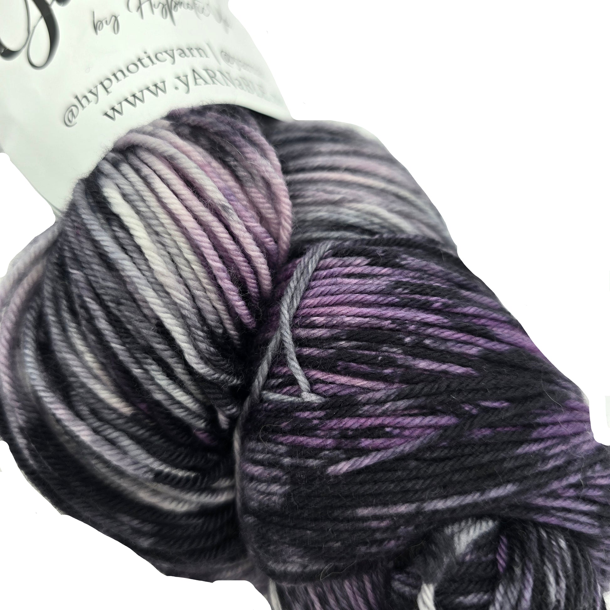 Close-up image of Plush Sock yarn by Hypnotic Yarn in the color Storm Watch with partial label on a white background.