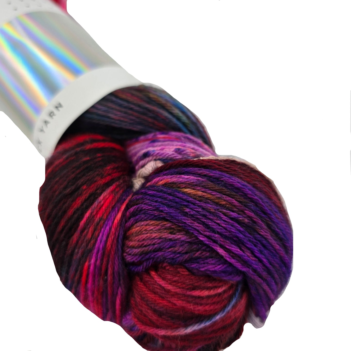 Close-up image of Sock Yarn by Hedgehog Fibres in the color Potluck with partial label on a white background.