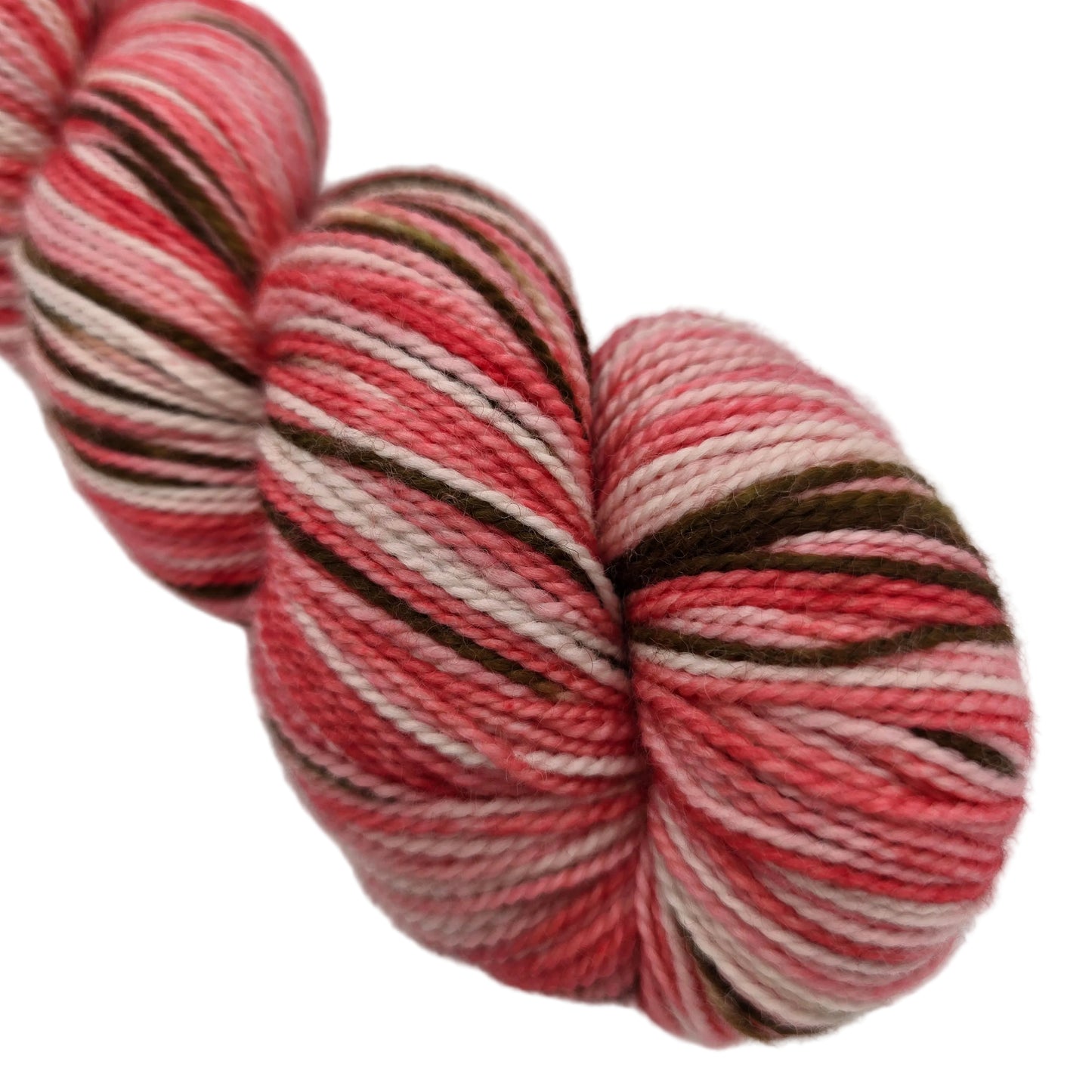 Close-up image of Sock Yarn by Sundara Yarn in the color Cherry Blossom on a white background.