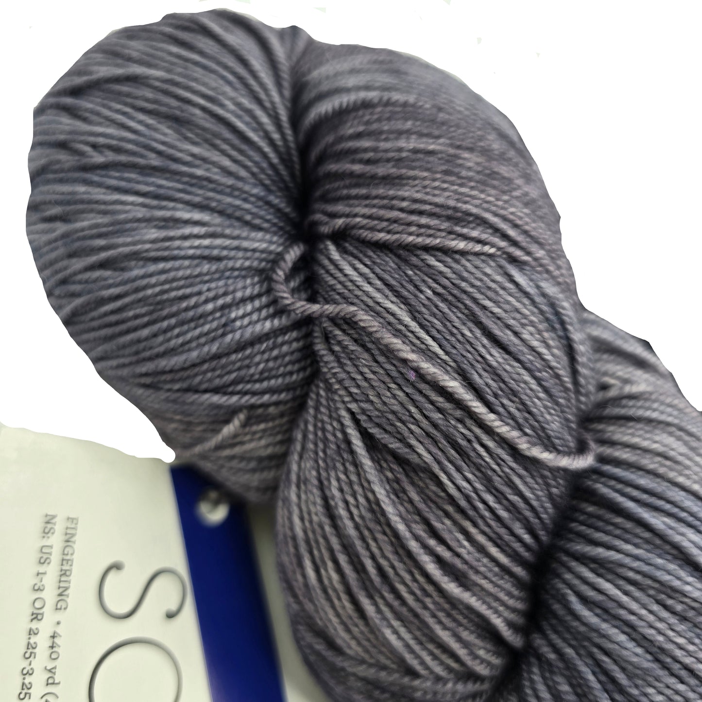 Close-up image of Sock yarn by Malabrigo in color 043 Plomo with partial label on a white background.