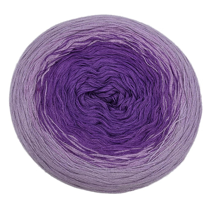 Image from above a single cake of Sultan_Gradient_yarn by_Cotton_Kings_Hobbii_-_Color_06_Amethyst on a white background.