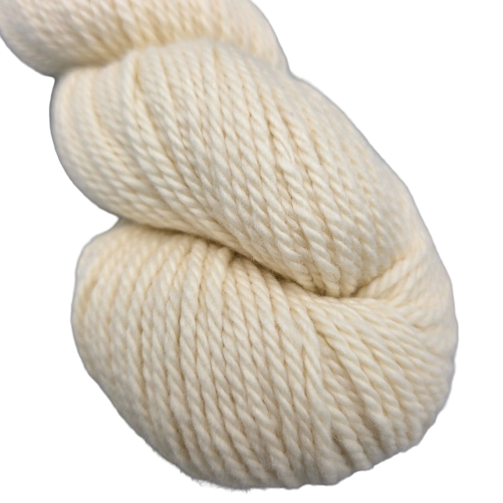 Close-up image of Sweater_Worsted_yarn by_Blue_sky_in the color_Ice_Cream_7500 on a white background.