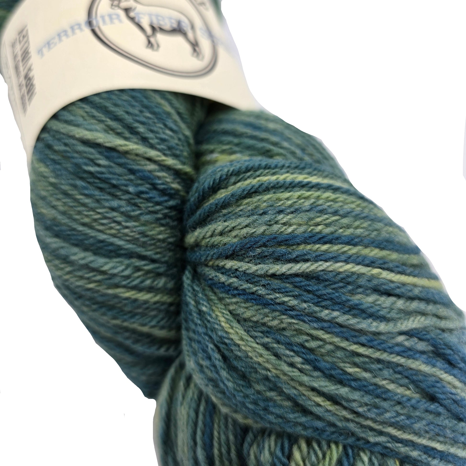 Close-up image of Terroir Series Cormo Sport Yarn by Sincere Sheep in the color suerte with partial label on a white background.
