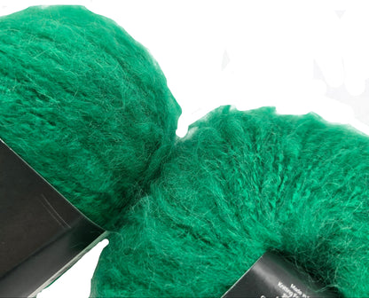 Close-up image of Whisper Yarn by Jody Long in Gem Color 008 on a white background.