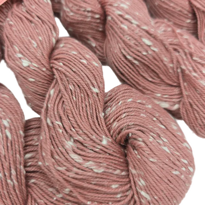 Close-up image of Willow Tweed yarn by Louisa  in Color 16 Flower on a whiye background.