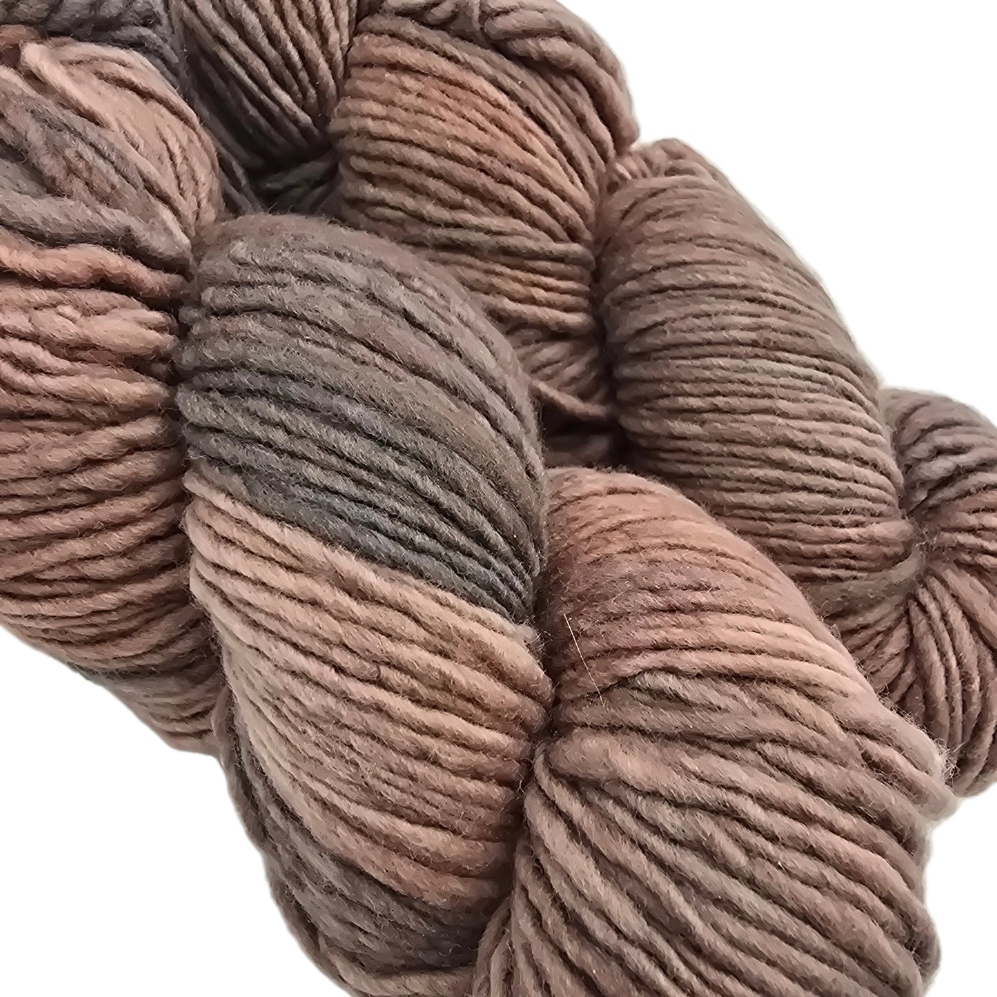 Close-up Image of two skeins of Worsted by Malabrigo Yarn in color 74 Polvoriento on a white background.