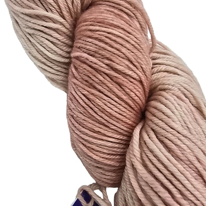 Close-up Image of a single skein of Arroyo by Malabrigo yarn in the color Neverland on a white background.
