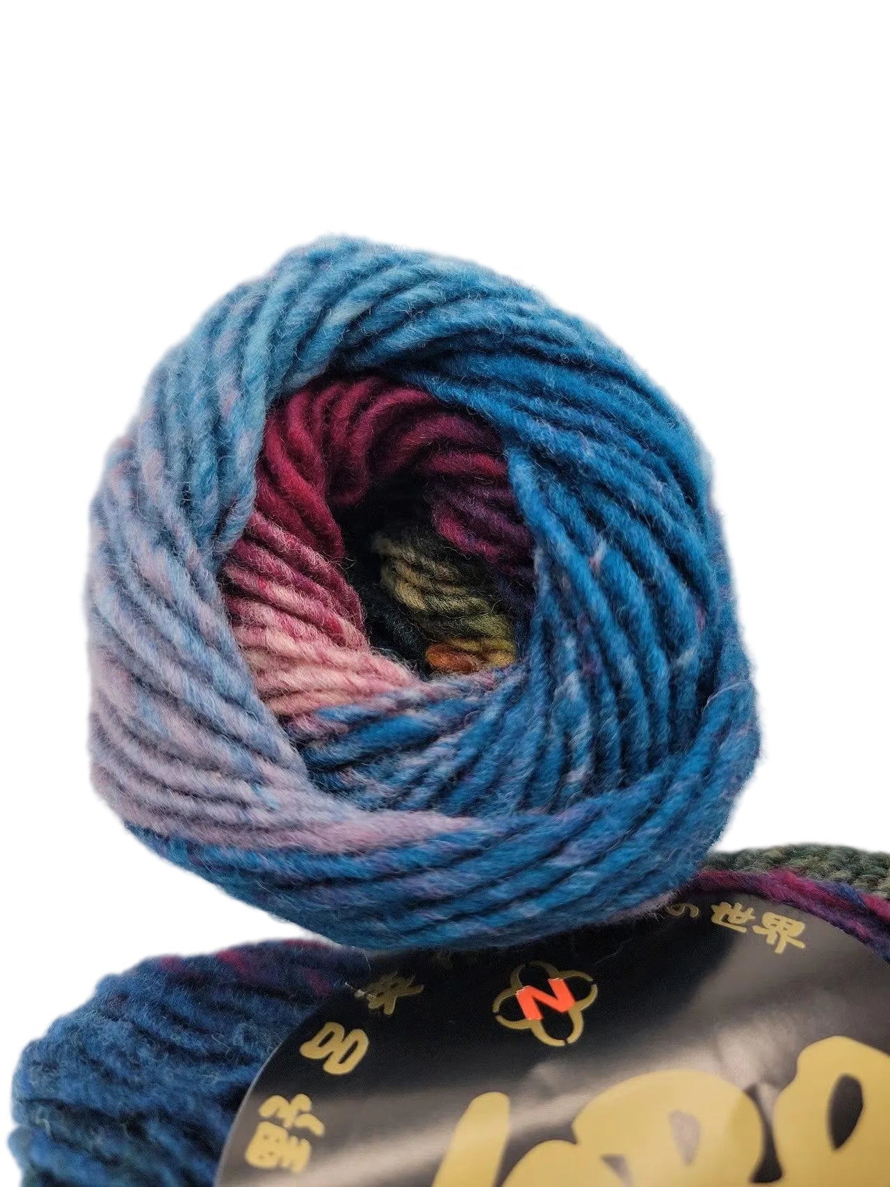 Close-up image of multicolor Kureyon Yarn by Noro in color 170 with labels on a white background.