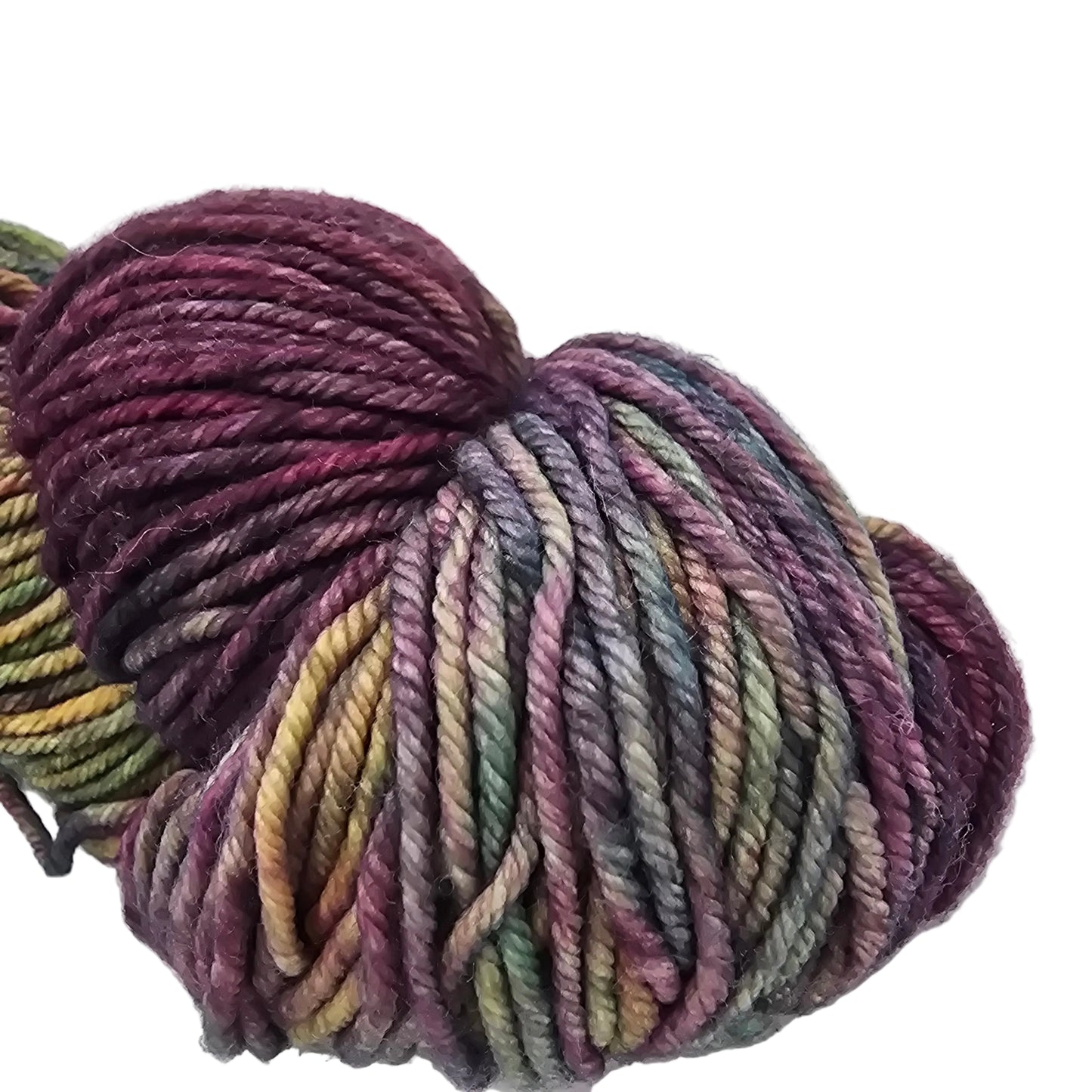 Close-up Image of a single skein of Rios by Malabrigo Yarn in the color 886 Diana which is a purple heavy multicolor with label in a white background.