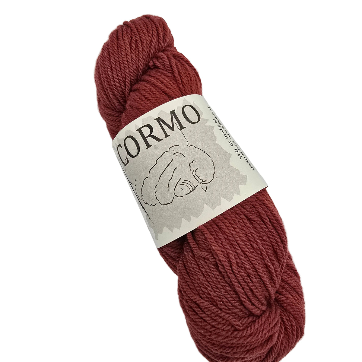 A skein of rust-red yarn with a paper label reading 'CORMO' and a simple line drawing, photographed on a plain white background.