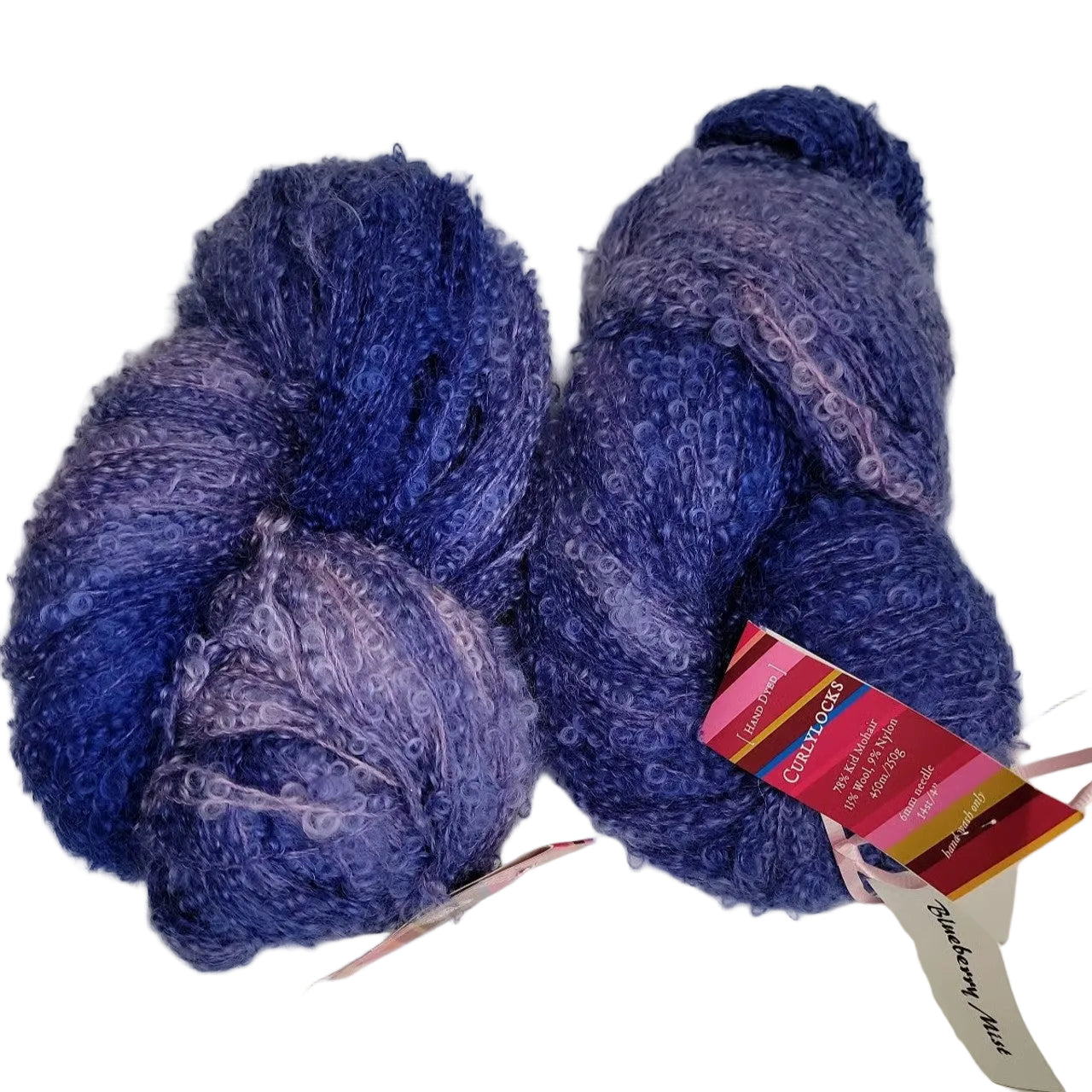 Image of two hanks of Curly Locks by Fleece Artist Yarn in the color Blueberry Mist with labels on a white background.