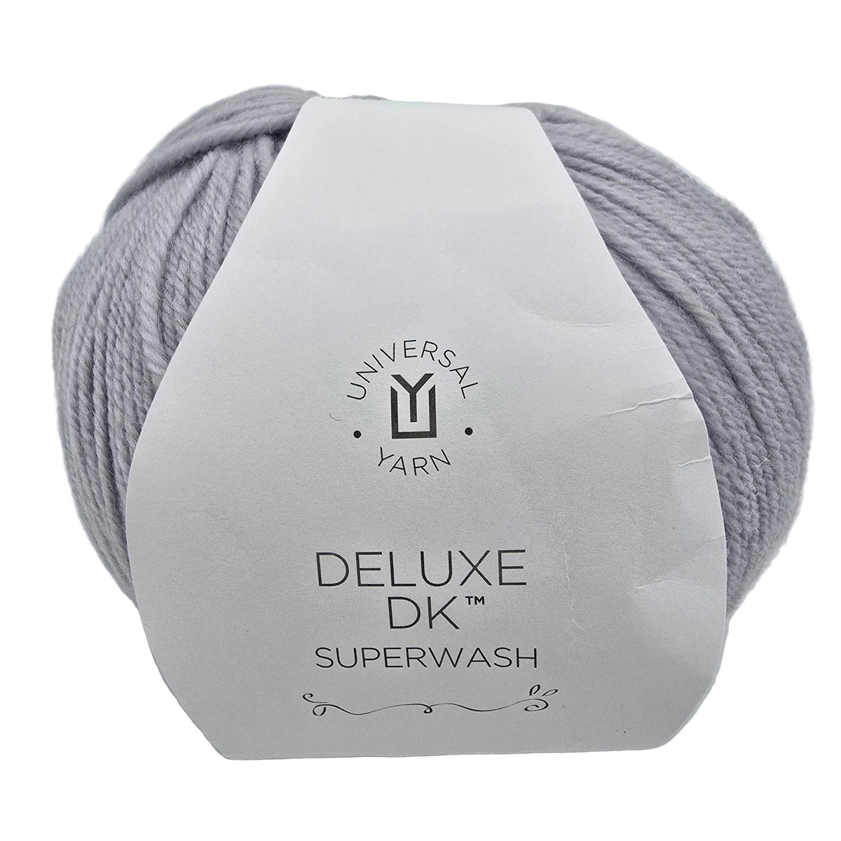A ball of  Deluxe DK Superwash yarn in the color Ice Rustic a light lavender-gray colorway, wrapped in a white paper label.