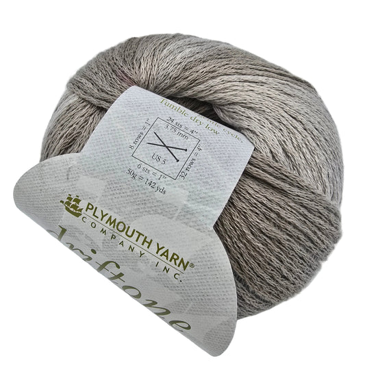 A ball of Plymouth Yarn Driftone US-5 yarn in a heathered taupe-gray color, wrapped with a white paper label showing product details.