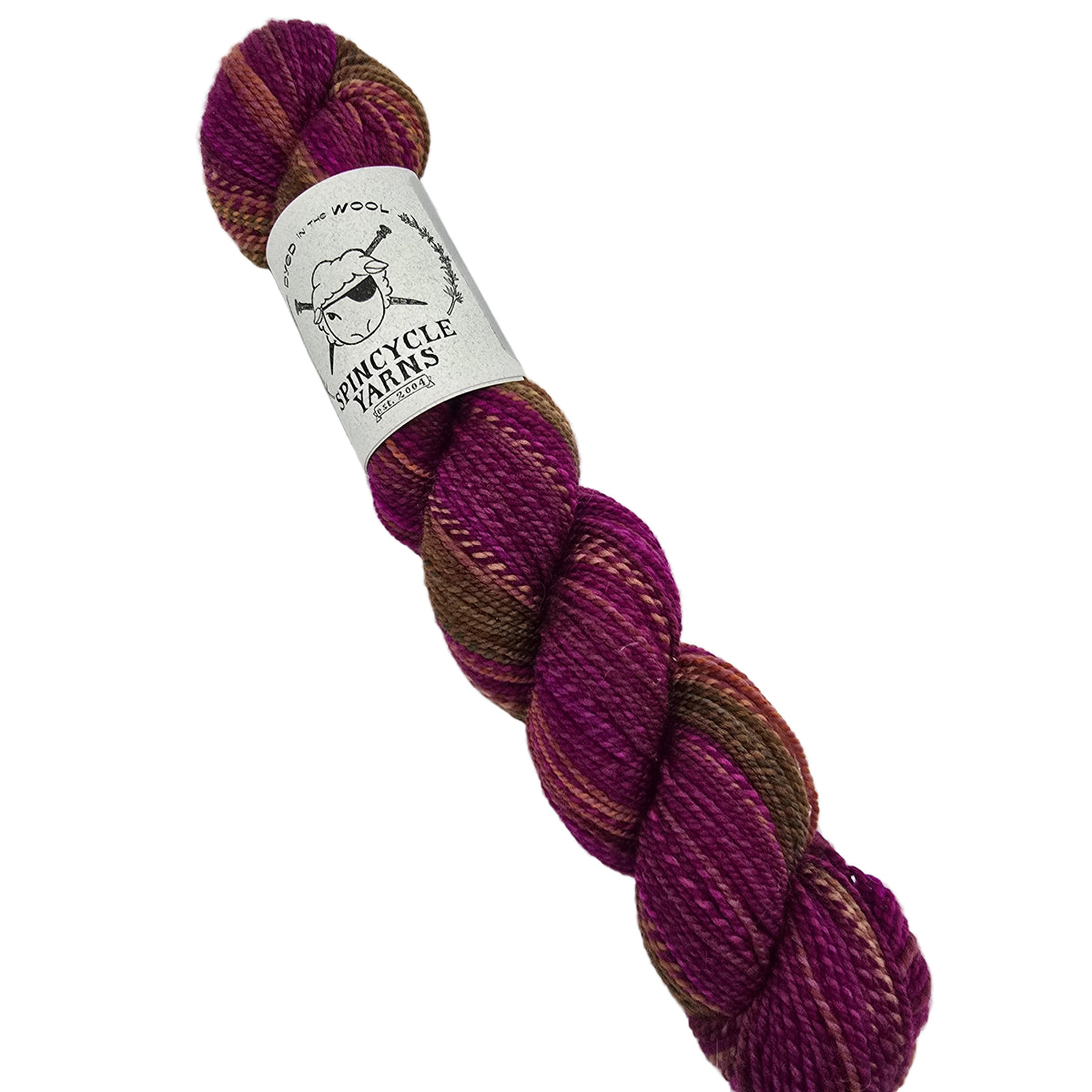 A single skein of Dyed_in_Wool yarn_by_Spincycle_Yarns in the color_Dirty_Little_Secret a variegated yarn, featuring stripes of deep magenta,  and brown, with a white paper label wrapped around the center.