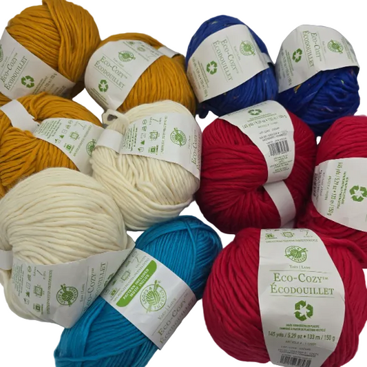 A group of Eco Cozy balls and skeins of yarn by Loops & Threads in  Assorted  colors, including mustard yellow, royal blue, navy blue, cream, red, and bright blue, arranged together on a White background.
