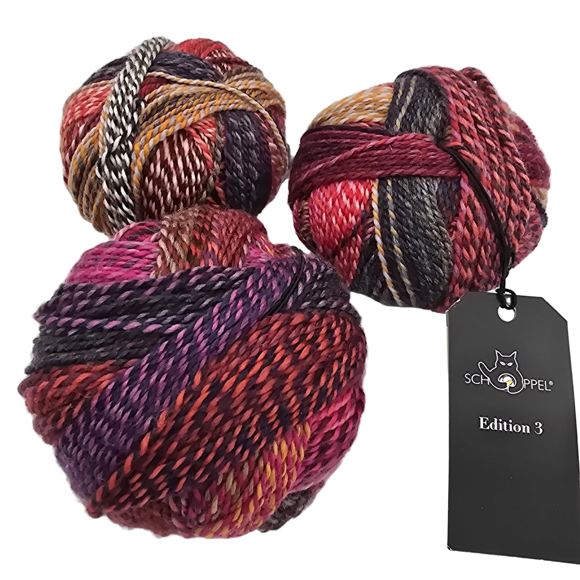 Image of 3 balls of  Yarn by the brand Schoppel Wolle in a color called Tante Emma (which is a multicolored yarn with reds, pinks, oranges, and blacks) with a black tag on a white background.