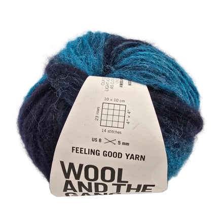 Image of a single ball of Feeling Good Yarn by Wool And The Gang in the color Northern Lights Green Stripe with label on a white background.