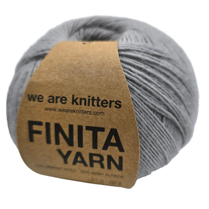 Image of a single ball of Finita yarn by We Are Knitters in Grey with label on a white background.