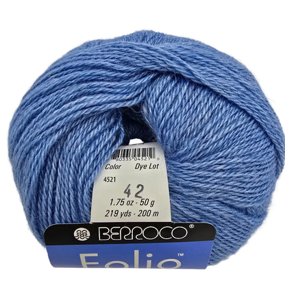 A ball of Berroco Folio yarn in a medium blue shade, with a white paper label showing the color number 4521 and a blue and black brand tag at the bottom.