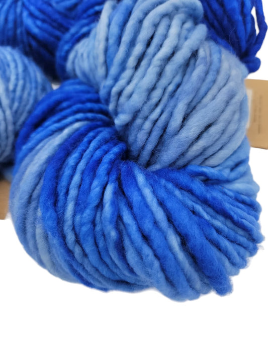 Close-up image of Francos by Manos Del Uruguay Blue Merino Yarn on a white background.