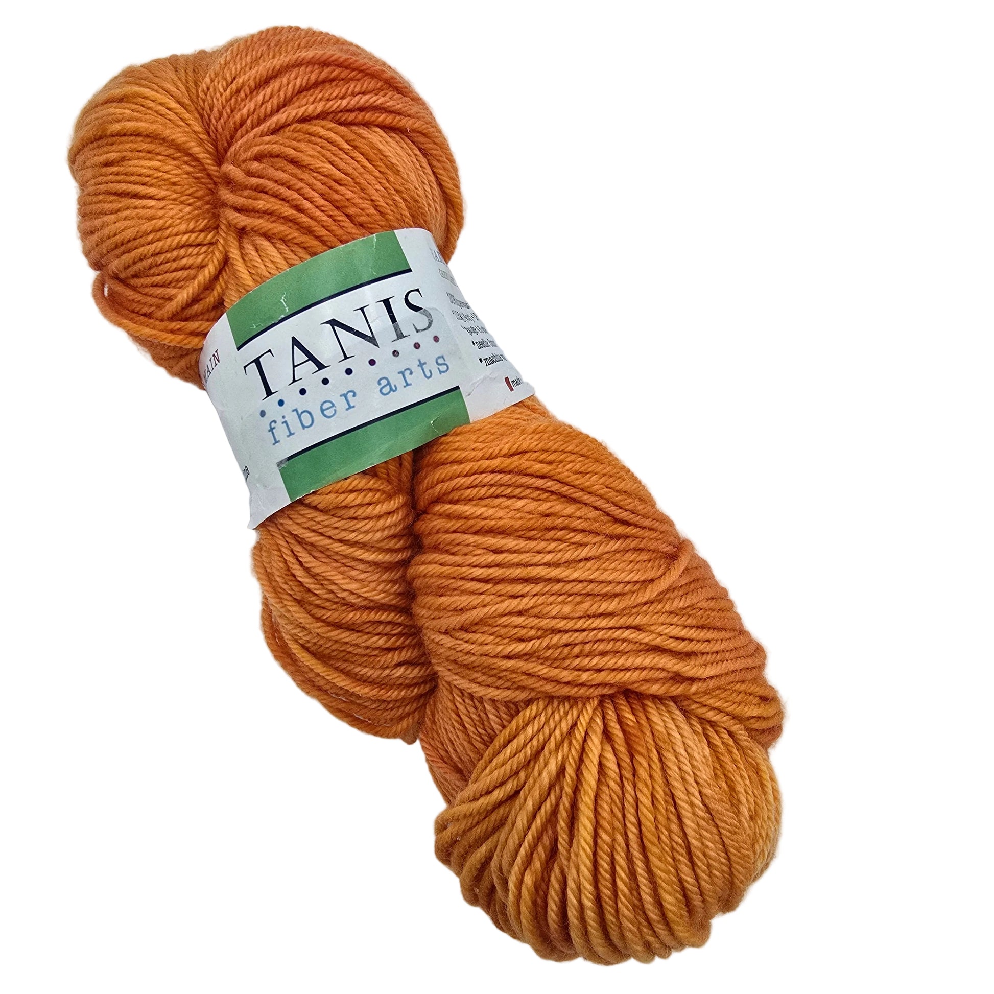 Image of a single skein of Green Label Aran Weight Yarn by Tanis Fiber Arts in the color Orange Blossom with label in a white background.