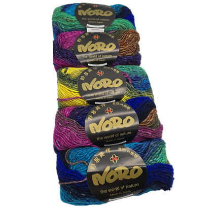 Five skeins of multicolored Noro Silk Garden yarn with labels on a white background.