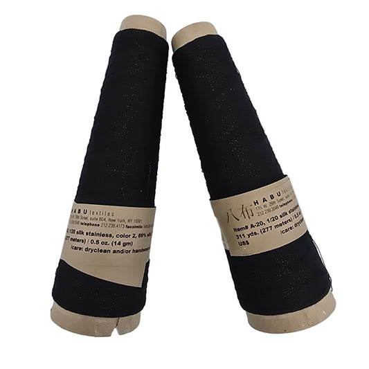 Two cones of Habu Textiles color 2, 1/20 silk stainless Black fiber with labels on a white background.