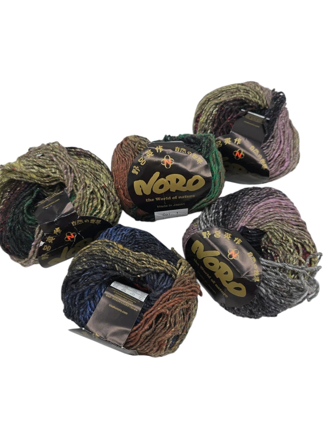 Five skeins of multicolor Hanabatake by Noro yarn with label on a white background.