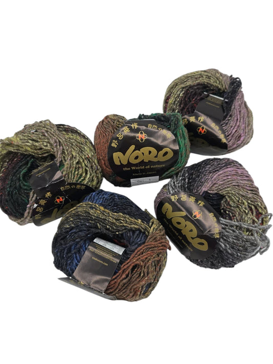 Five skeins of multicolor Hanabatake by Noro yarn with label on a white background.