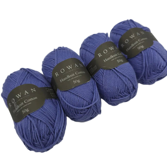 Image of four skeins of Handknit Cotton Yarn by Rowan in the color 353 Violet with labels on a white background.
