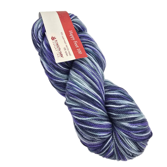 A skein of variegated yarn with purple, blue, and white stripes, wrapped with a paper label that reads 'Happy Feet 100' on a white background.
