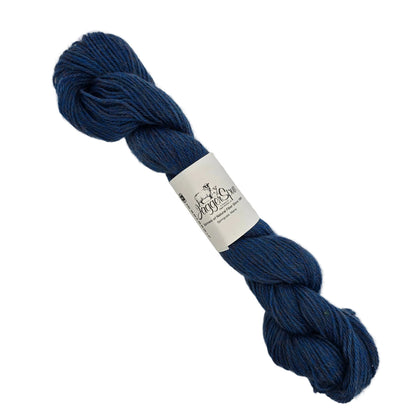Image of a single skien of Heather 3/8 yarn by JaggerSpun in the color Cobalt with label on a white background.